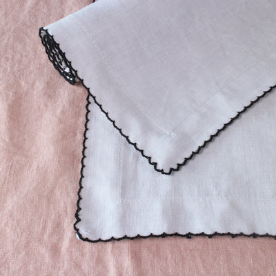 Crochet-edged napkin sets.